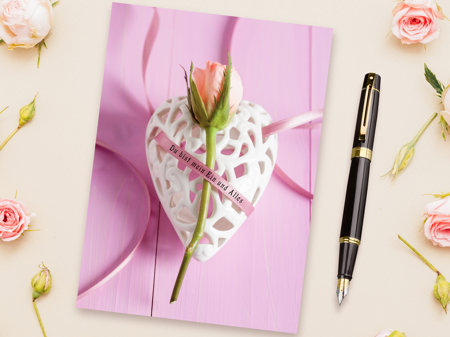 German language card with rosebud and romantic saying