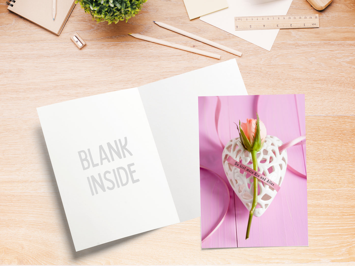 German language card with rosebud and romantic saying