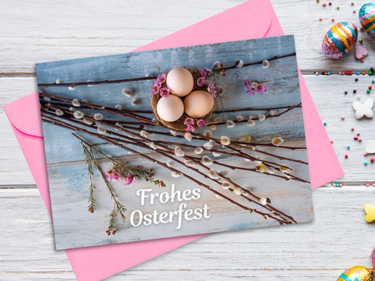 Easter card with eggs and willow branches on a wooden background with pink flowers and text "Frohes Osterfest".